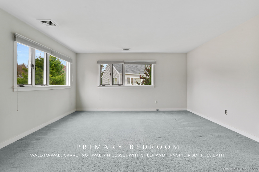 97 Field Point Drive, Unit 97 Fairfield, CT 06824 - Photo 22 of 40 a view of an empty room with a window