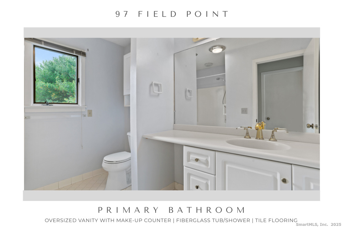 97 Field Point Drive, Unit 97 Fairfield, CT 06824 - Photo 23 of 40 a bathroom with a sink a toilet and a mirror