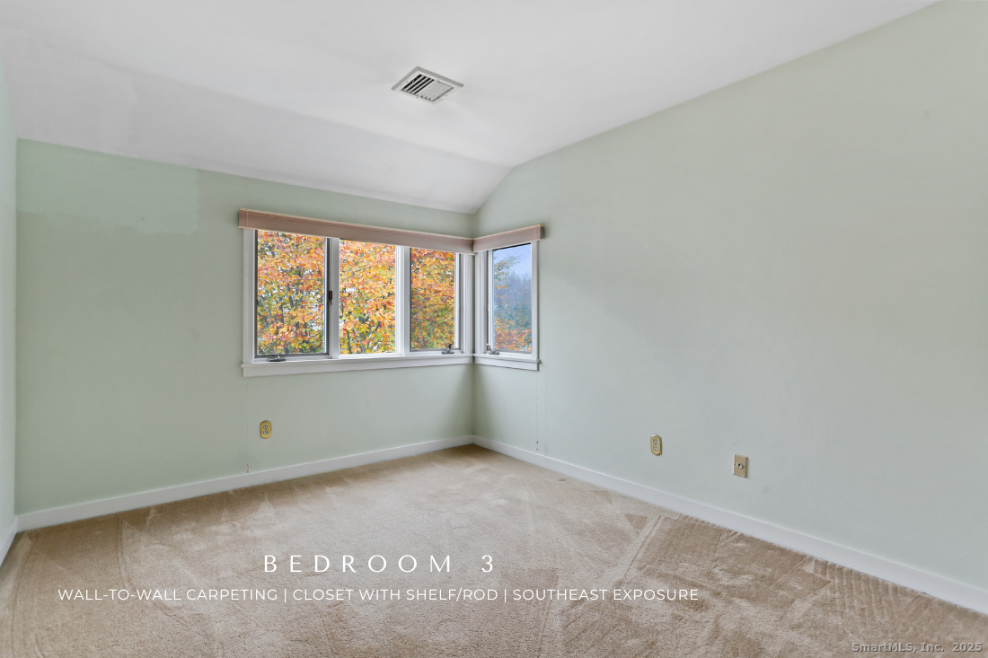 97 Field Point Drive, Unit 97 Fairfield, CT 06824 - Photo 26 of 40 a view of an empty room with a window