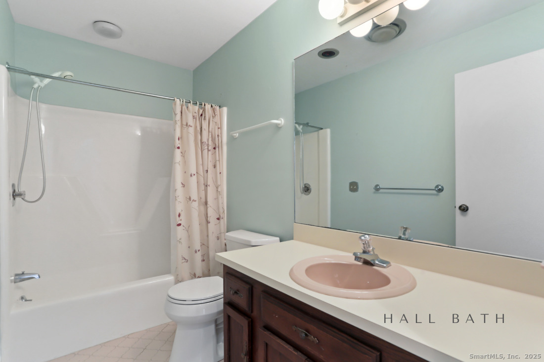 97 Field Point Drive, Unit 97 Fairfield, CT 06824 - Photo 27 of 40 a bathroom with a granite countertop sink toilet and shower