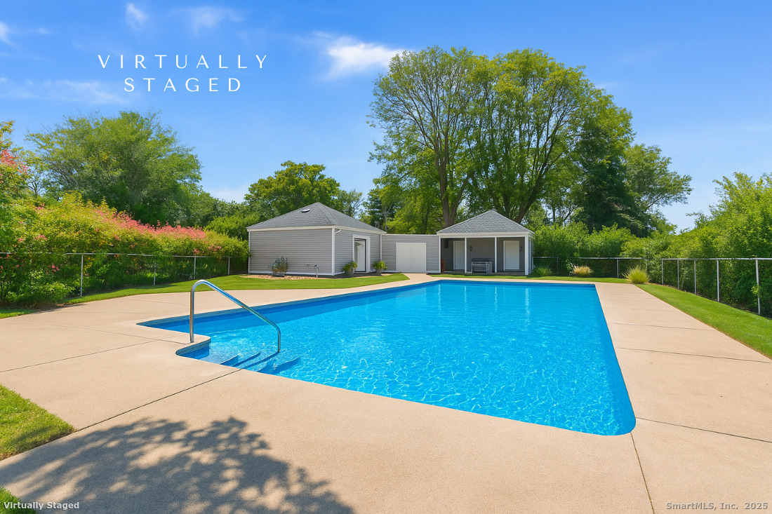 97 Field Point Drive, Unit 97 Fairfield, CT 06824 - Photo 31 of 40 a view of a house with a swimming pool