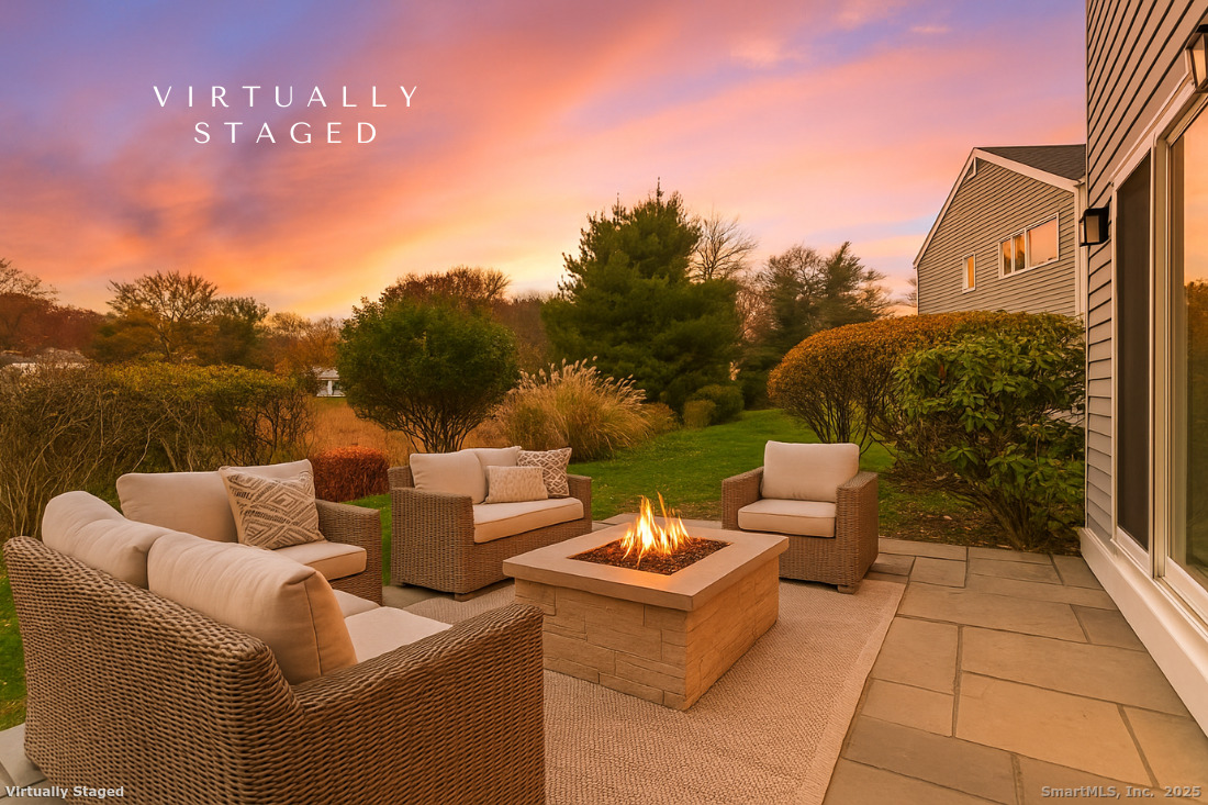 97 Field Point Drive, Unit 97 Fairfield, CT 06824 - Photo 4 of 40 a view of a patio with couches chairs and potted plants