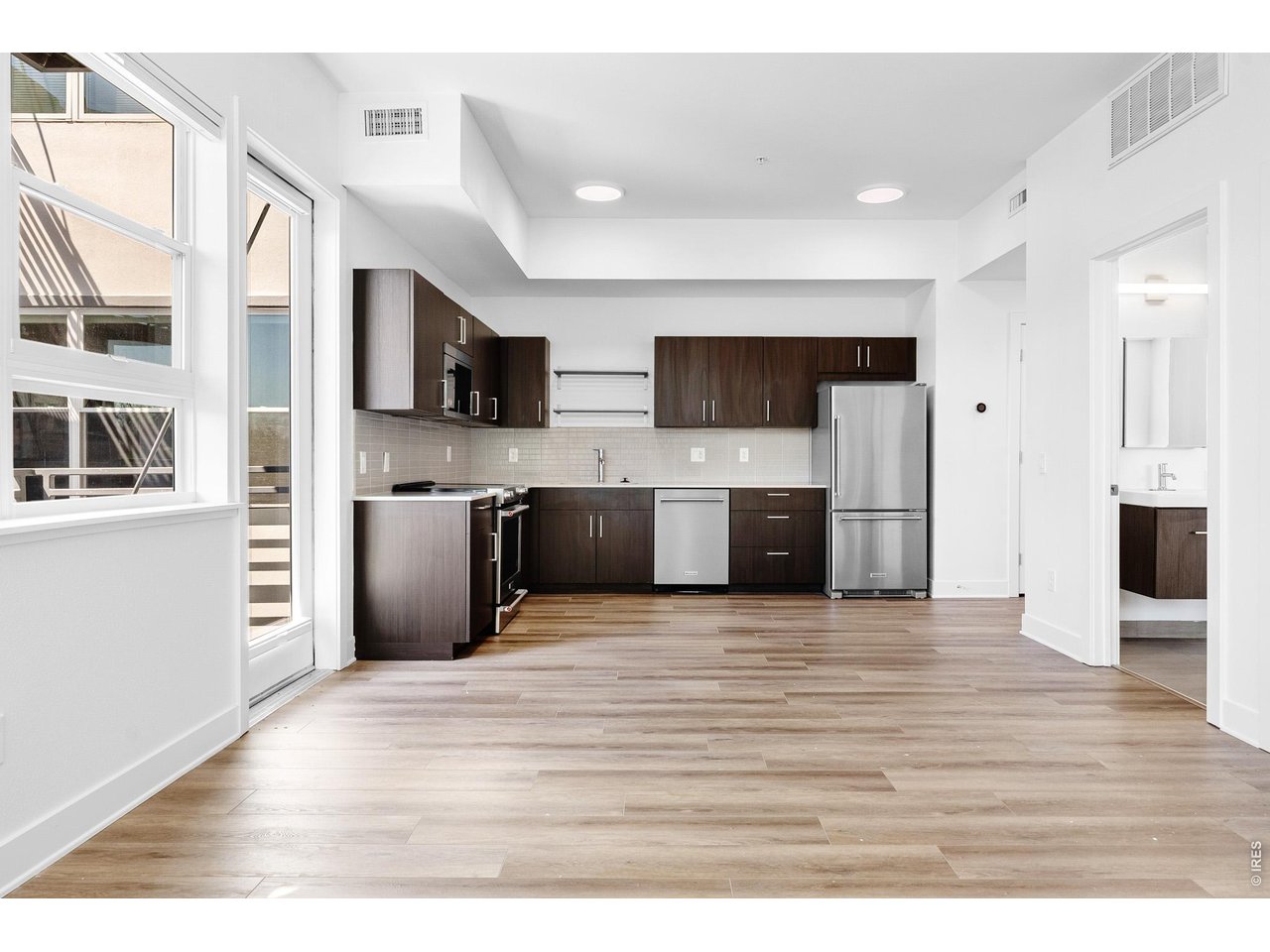 1707 Walnut Street, Unit 209 Boulder, CO 80302 - Photo 3 of 16 a view of living room kitchen with stainless steel appliances kitchen island