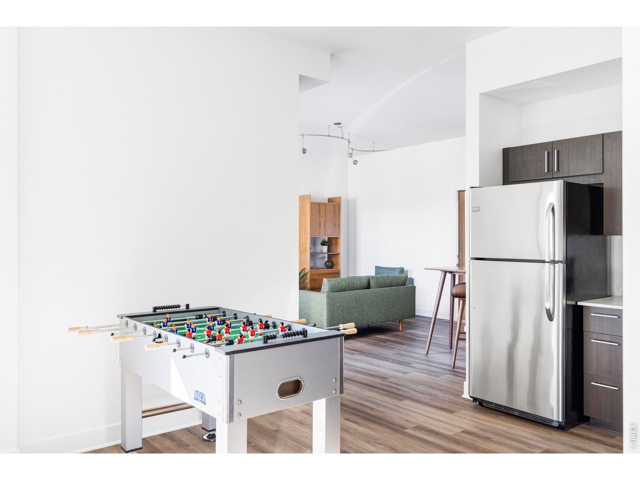 1707 Walnut Street, Unit 209 Boulder, CO 80302 - Photo 7 of 16 a kitchen with a refrigerator and a wooden floor