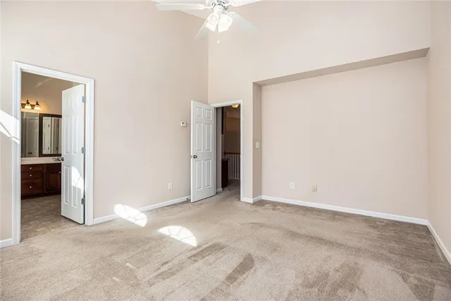 a view of an empty room with a fan