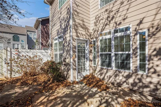 a backyard of a house with outdoor seating