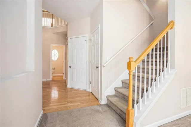 a view of an entryway with wooden floor