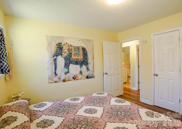 a bedroom with a bed and a window in it