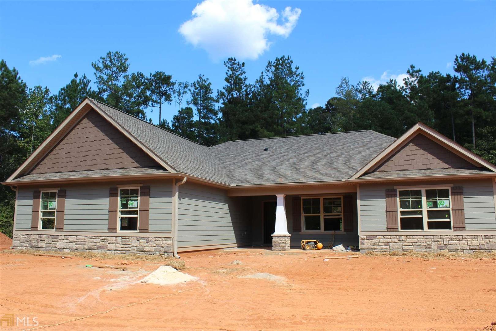 1195 Witcher Road, Unit 6 Newnan, GA 30263 - Photo 1 of 1 a front view of a house with a yard and garage