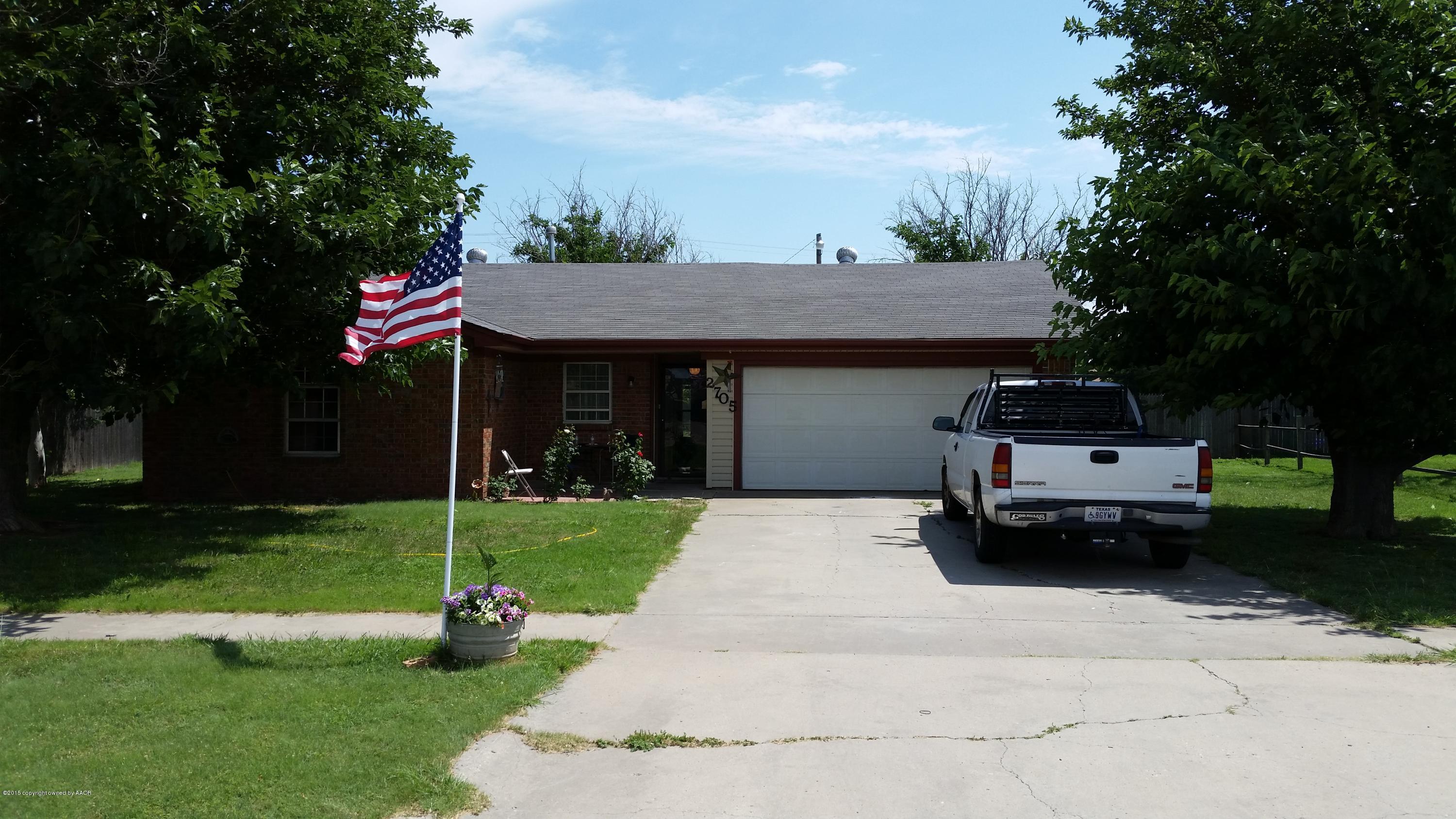 2705 Wilbur Drive Amarillo, TX 79110 - Photo 1 of 1 a front view of a house with a garden and trees