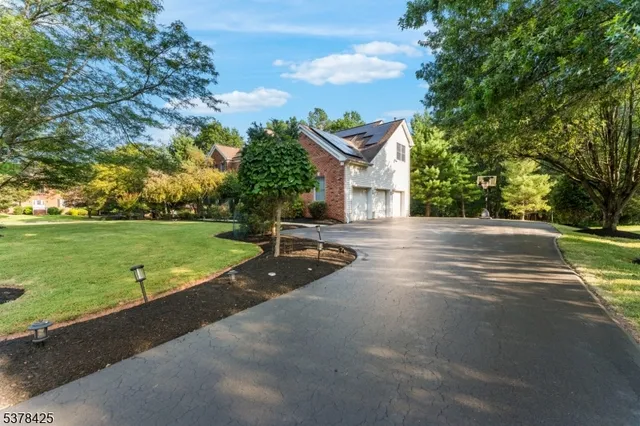 a view of a fountain in front of a house