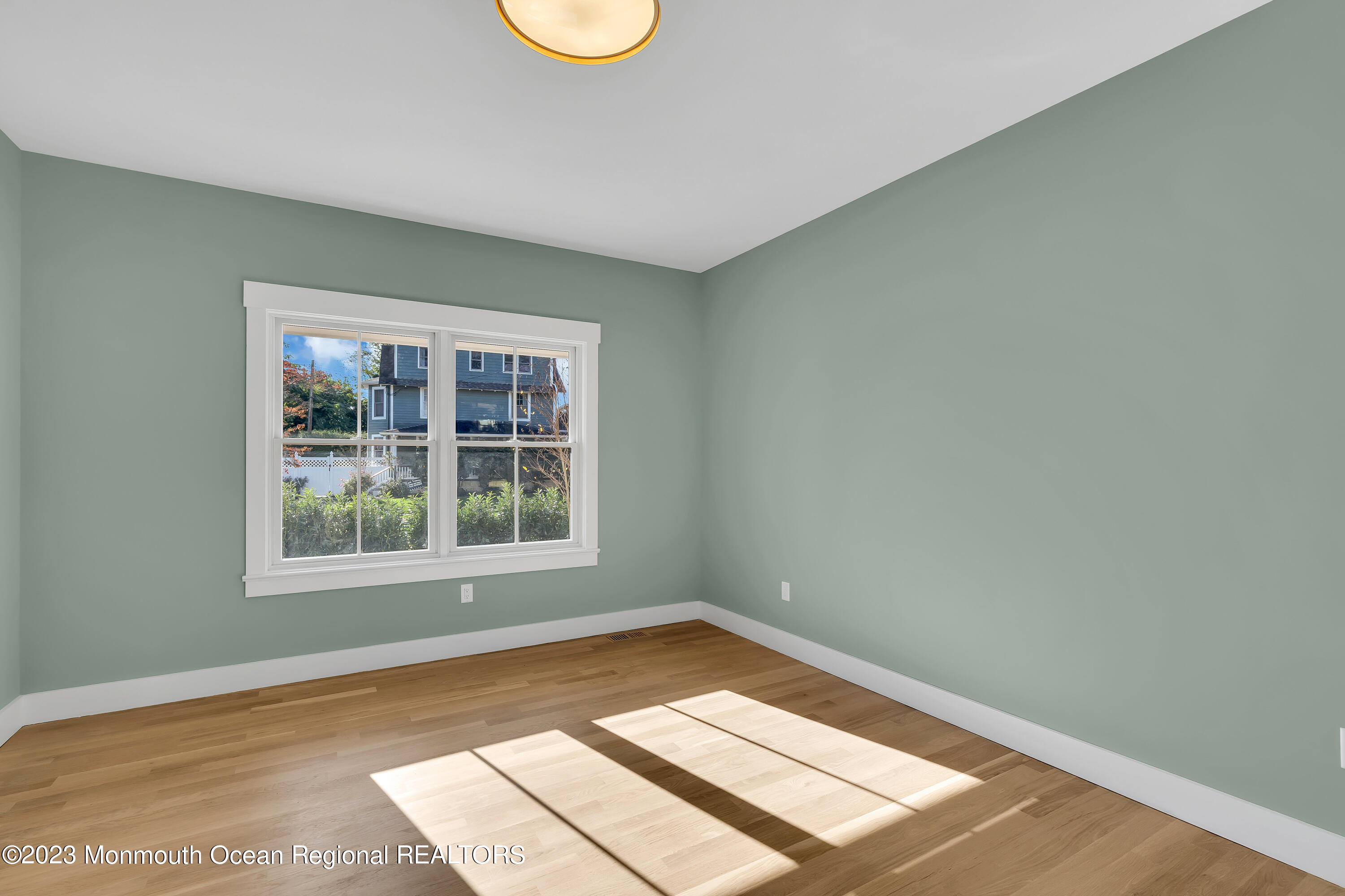 556 Church Street Spring Lake Heights, NJ 07762 - Photo 13 of 85 a view of a room with wooden floor and fan