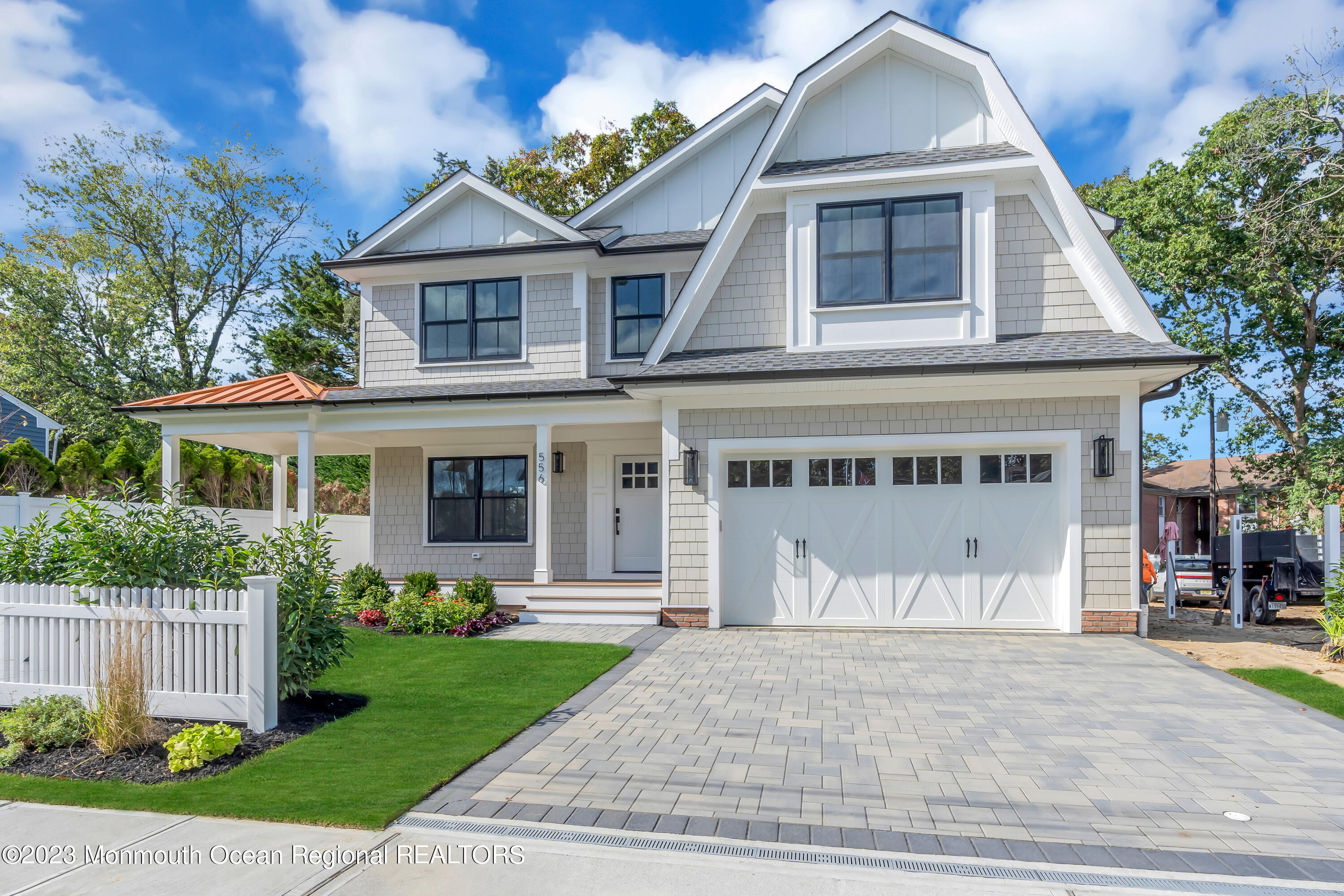 556 Church Street Spring Lake Heights, NJ 07762 - Photo 2 of 85 a front view of a house with a garden and plants