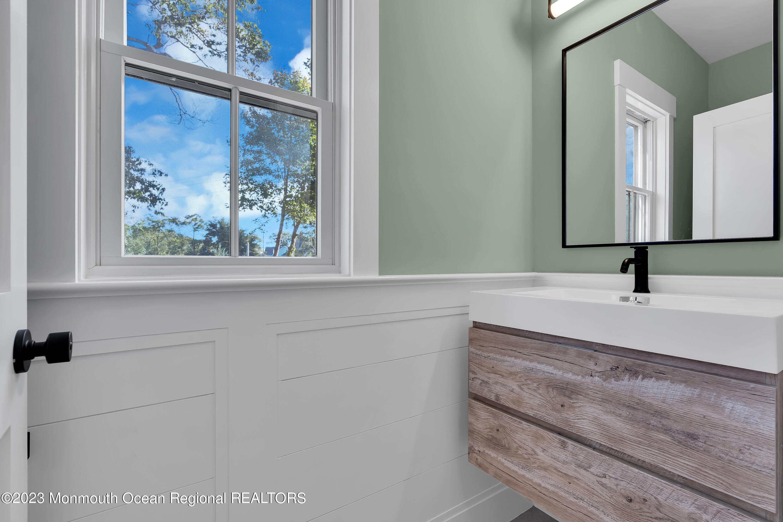 556 Church Street Spring Lake Heights, NJ 07762 - Photo 35 of 85 a bathroom with a sink and a mirror