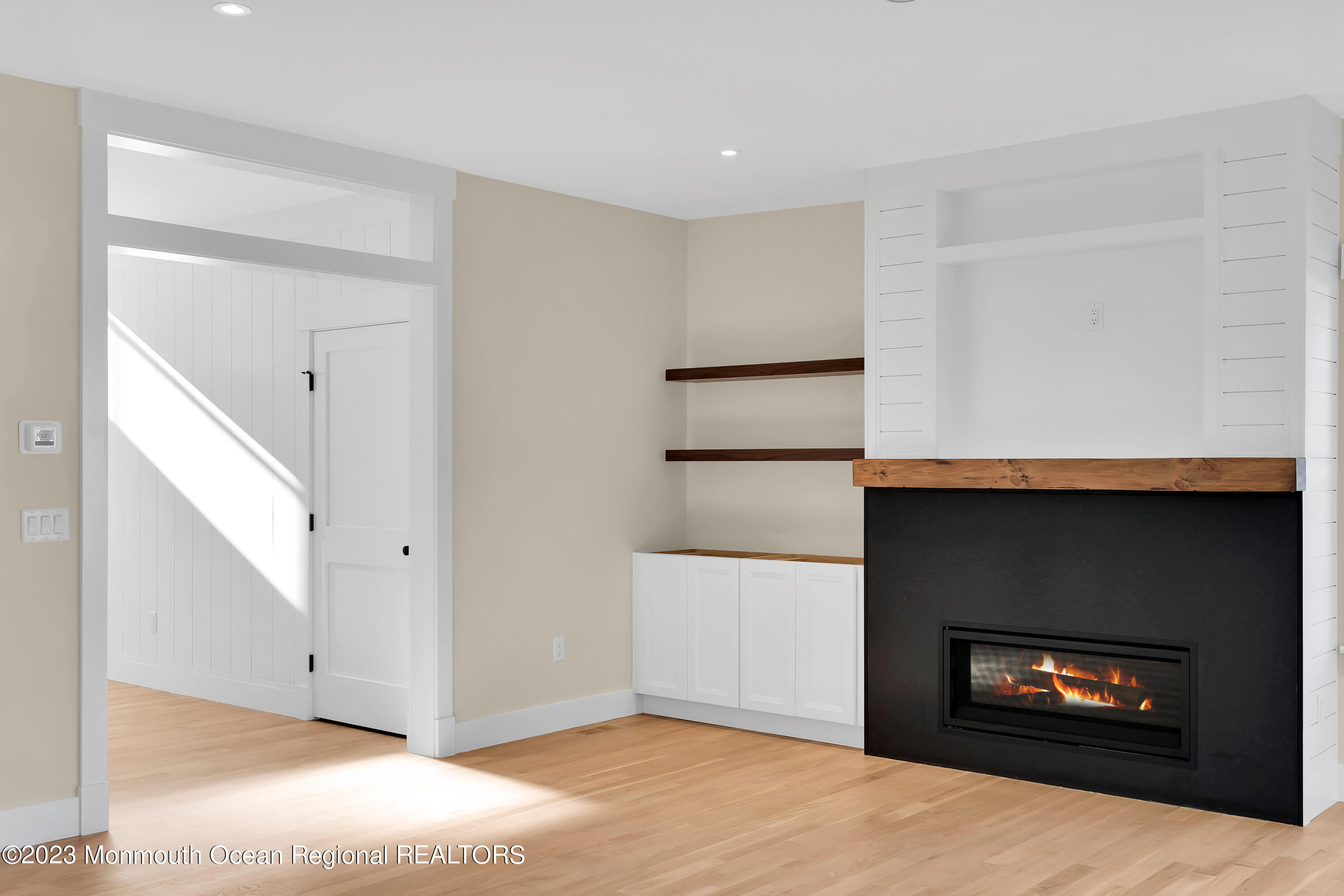 556 Church Street Spring Lake Heights, NJ 07762 - Photo 37 of 85 a view of an empty room with a fireplace and a window