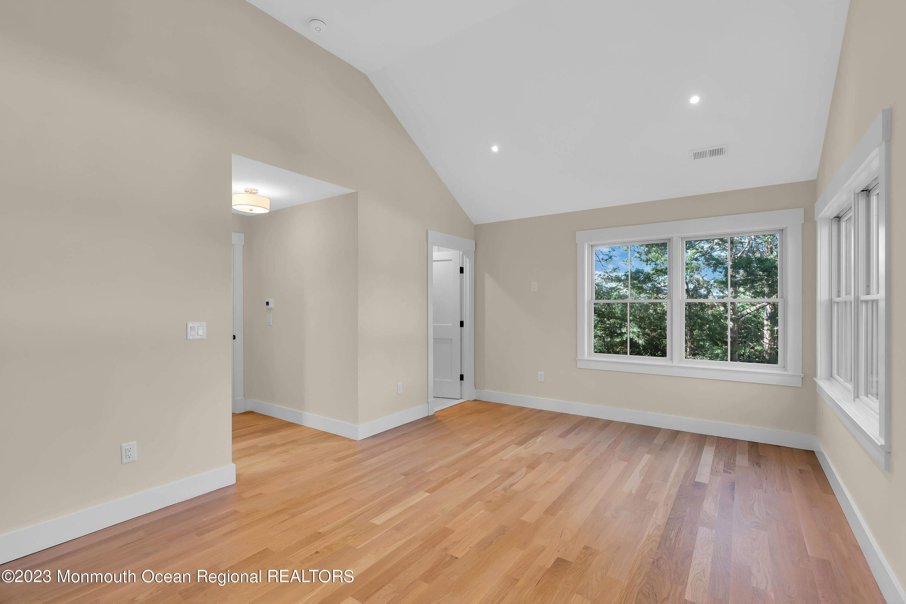 556 Church Street Spring Lake Heights, NJ 07762 - Photo 40 of 85 an empty room with wooden floor and windows