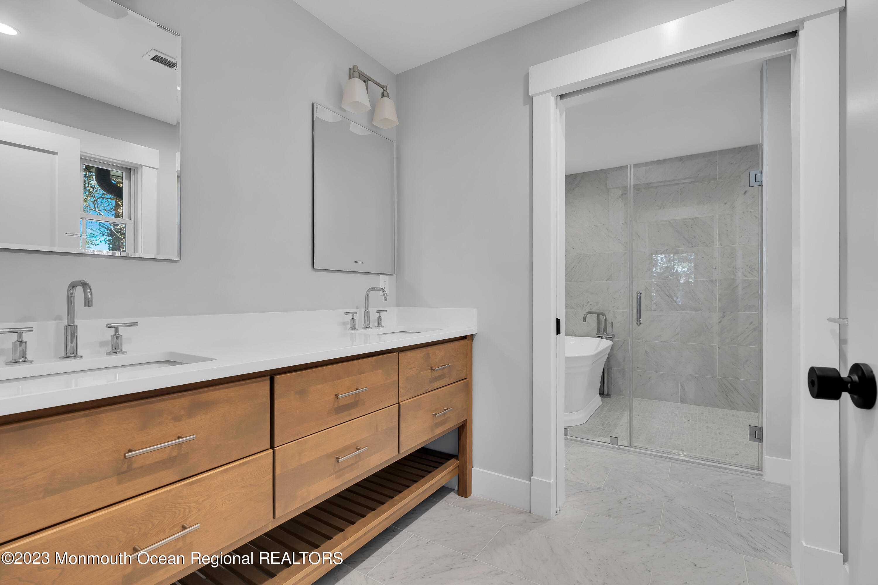 556 Church Street Spring Lake Heights, NJ 07762 - Photo 42 of 85 a spacious bathroom with a double vanity sink a toilet and a mirror