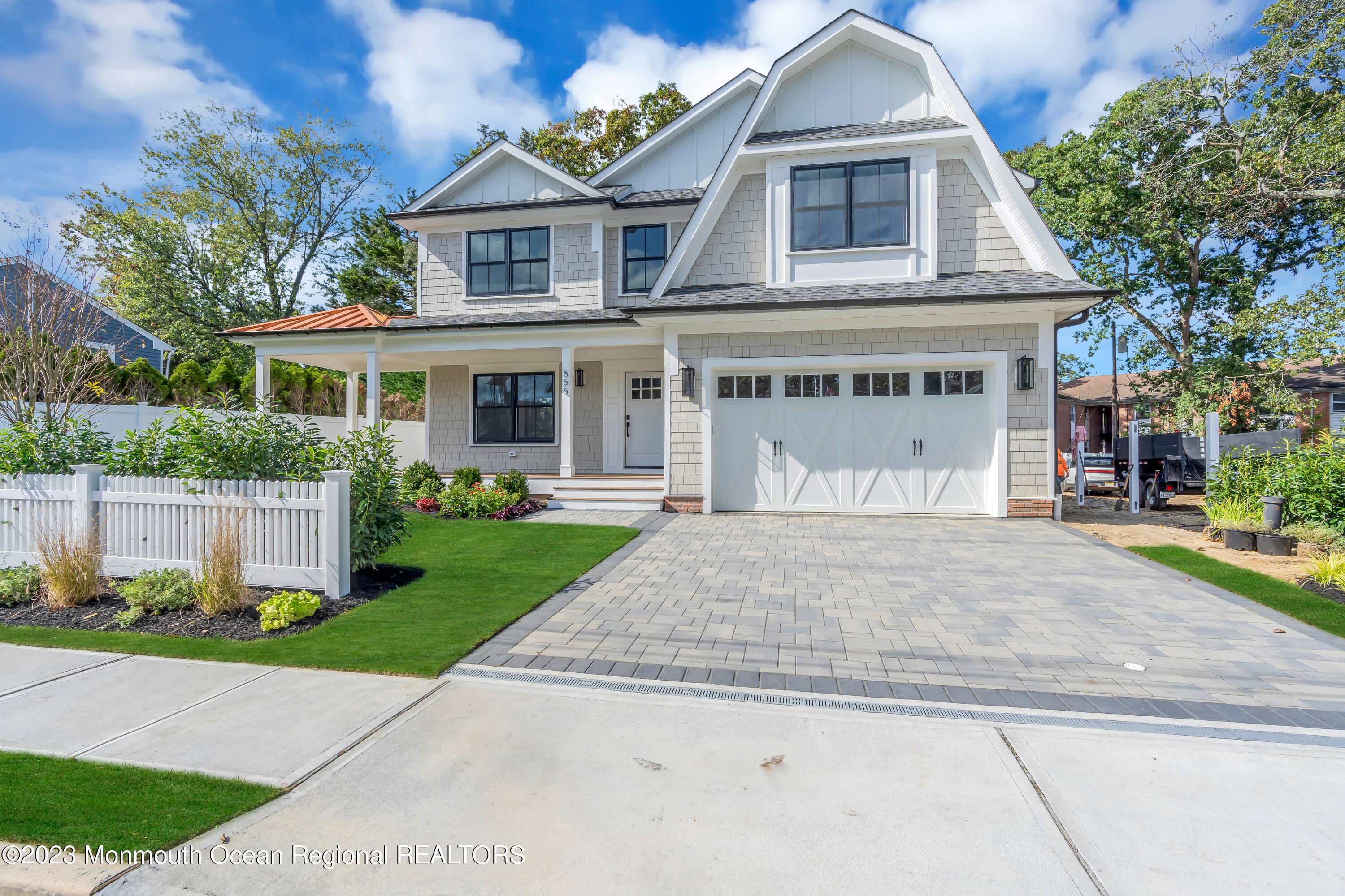 556 Church Street Spring Lake Heights, NJ 07762 - Photo 61 of 85 a front view of a house with a yard and garage