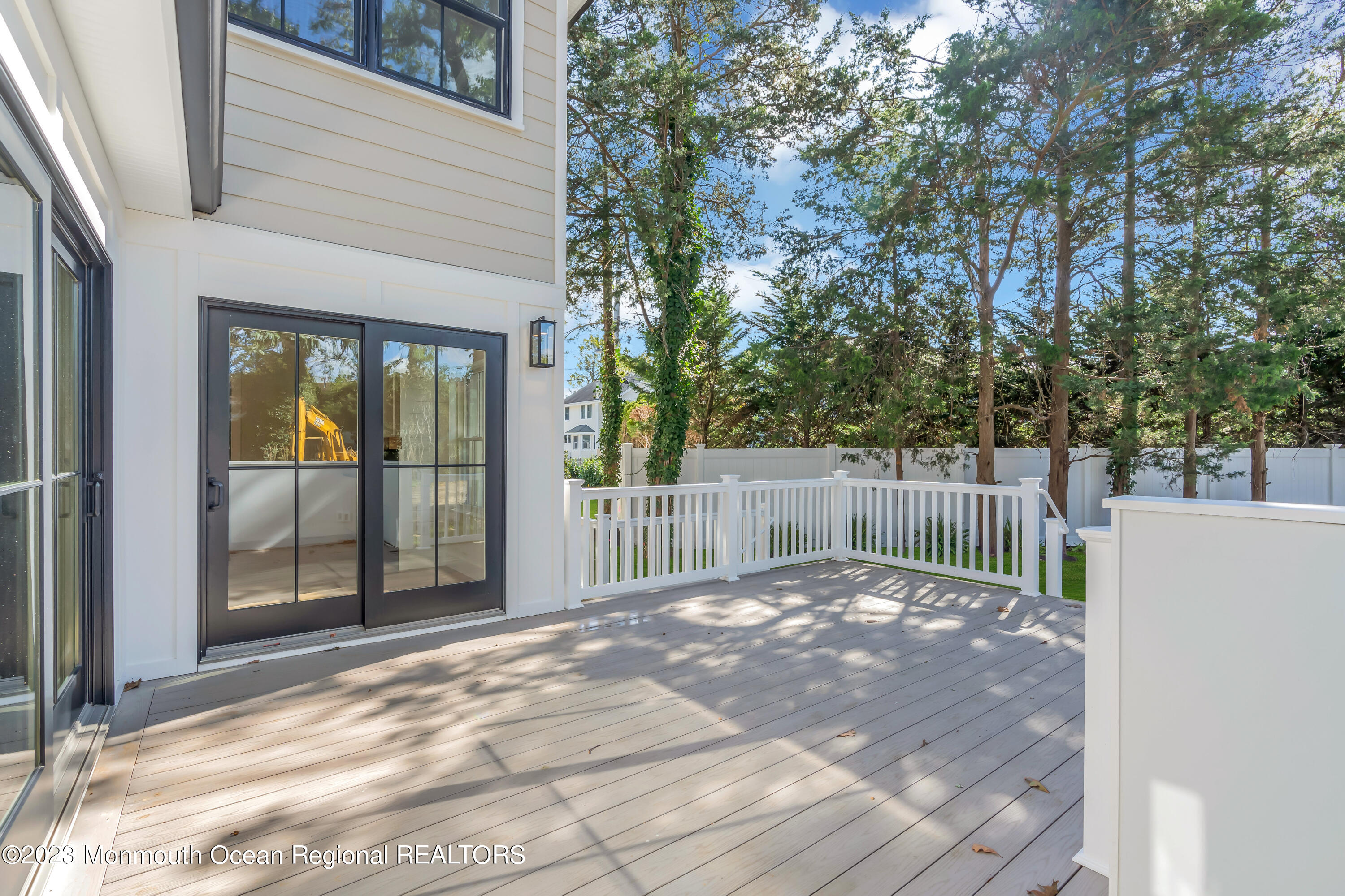 556 Church Street Spring Lake Heights, NJ 07762 - Photo 65 of 85 a view of backyard with large trees and wooden fence