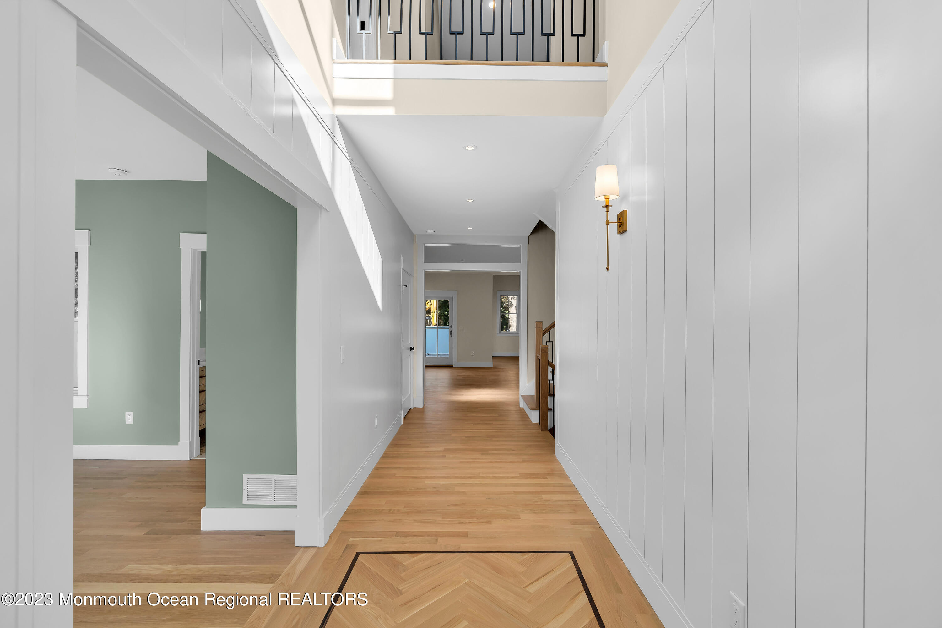 556 Church Street Spring Lake Heights, NJ 07762 - Photo 10 of 85 a view of a hallway with wooden floor and staircase