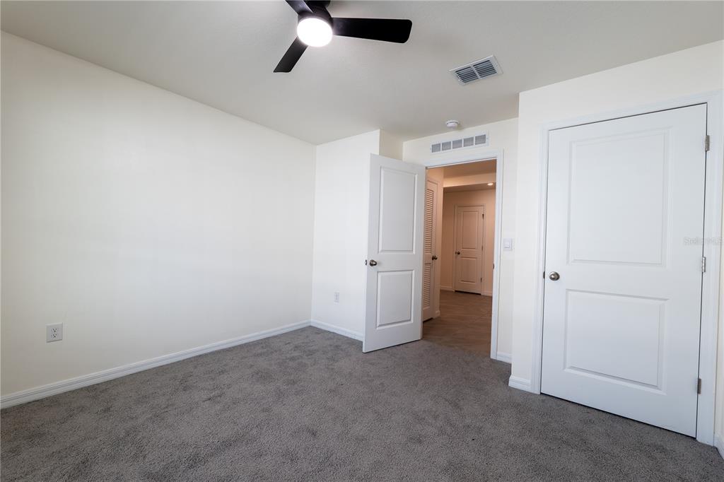 11272 Southeast 67th Circle Belleview, FL 34420 - Photo 19 of 24 an empty room with a bathroom