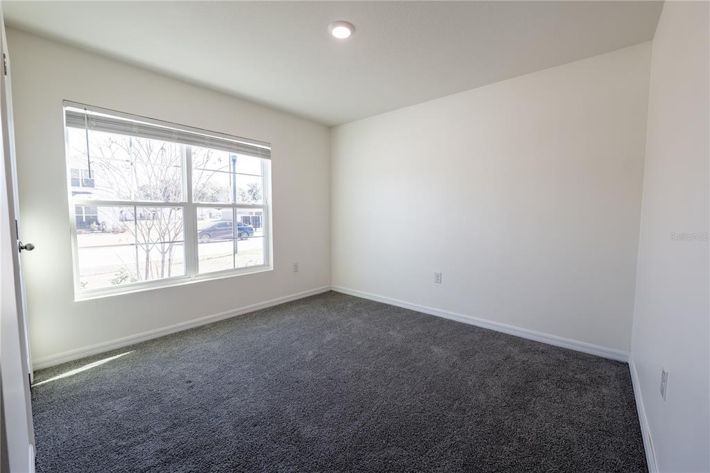 11272 Southeast 67th Circle Belleview, FL 34420 - Photo 21 of 24 an empty room with a window
