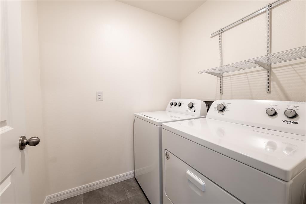 11272 Southeast 67th Circle Belleview, FL 34420 - Photo 22 of 24 a utility room with dryer and washer