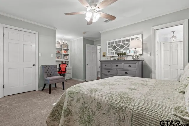 a bedroom with a bed and furniture