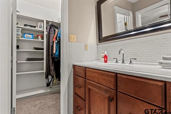 a bathroom with a sink and a mirror