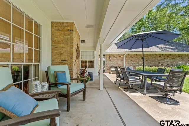 a view of a backyard with parked cars