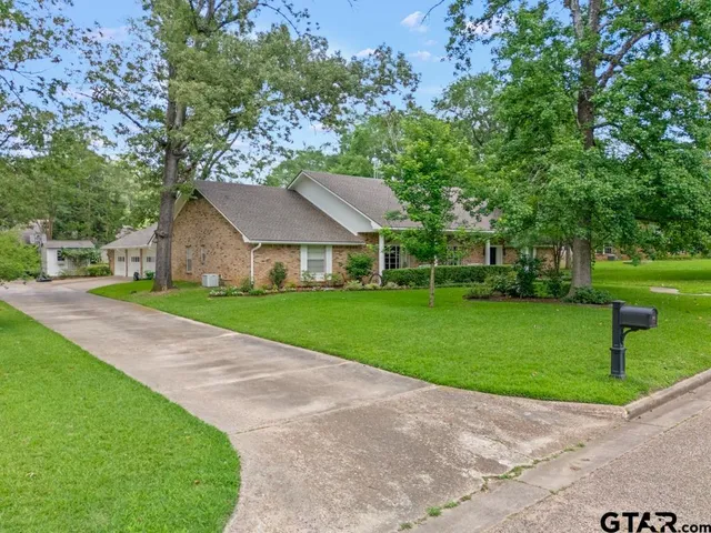 an aerial view of a house with a garden