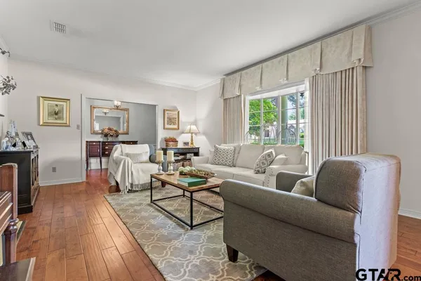 a living room with furniture and a window