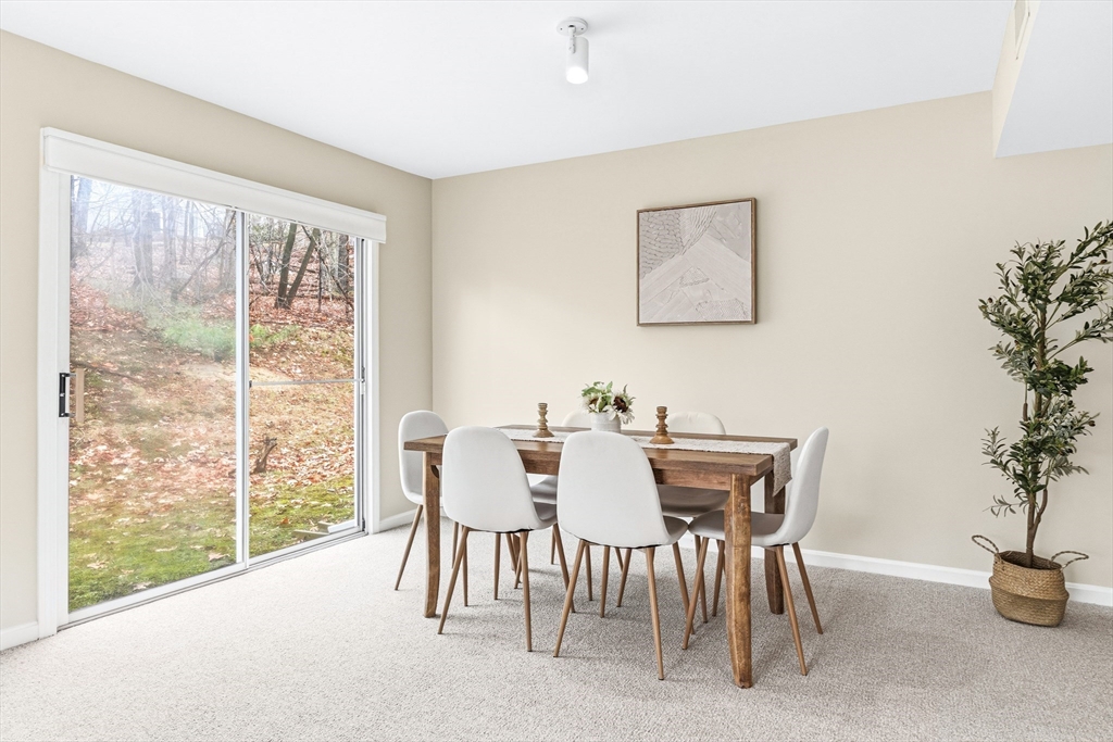 4 Drummer Boy Way, Unit 4 Lexington, MA 02420 - Photo 11 of 37 a view of a dining room with furniture window and outside view