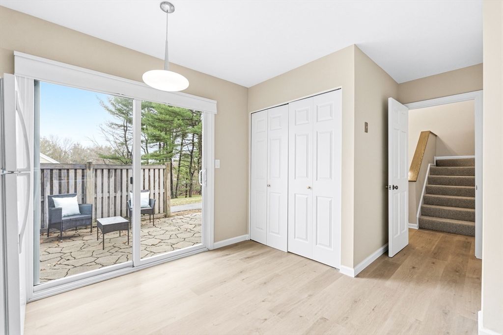 4 Drummer Boy Way, Unit 4 Lexington, MA 02420 - Photo 19 of 37 a view of a room with wooden floor and stairs