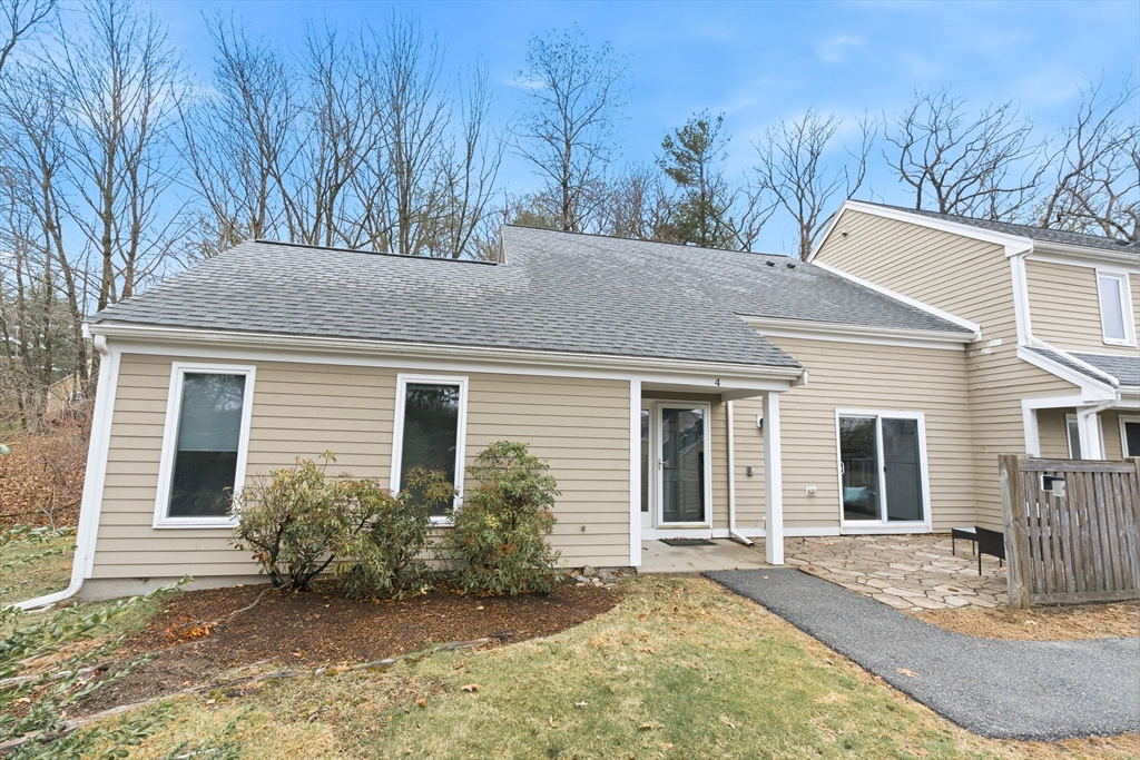 4 Drummer Boy Way, Unit 4 Lexington, MA 02420 - Photo 2 of 37 a view of a house with a yard and large tree