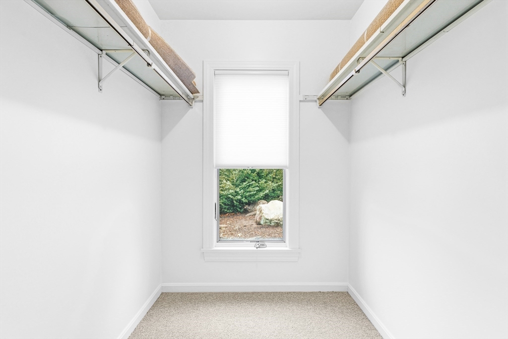 4 Drummer Boy Way, Unit 4 Lexington, MA 02420 - Photo 24 of 37 a view of a hallway with a window
