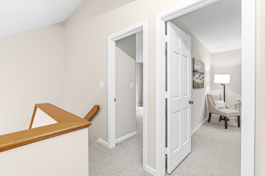 4 Drummer Boy Way, Unit 4 Lexington, MA 02420 - Photo 26 of 37 a view of a hallway with living room and furniture