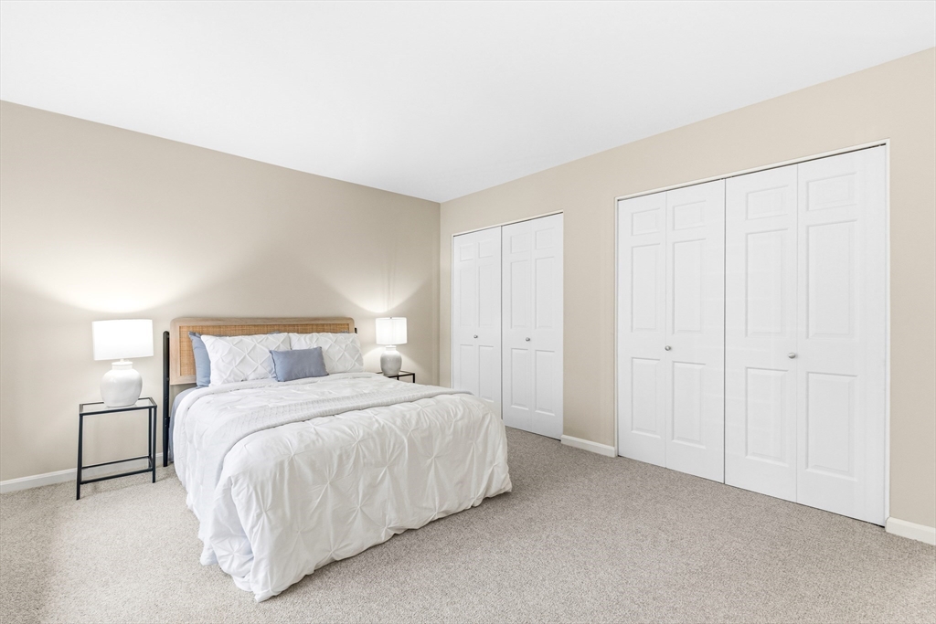 4 Drummer Boy Way, Unit 4 Lexington, MA 02420 - Photo 27 of 37 a bedroom with a bed and a night lamp