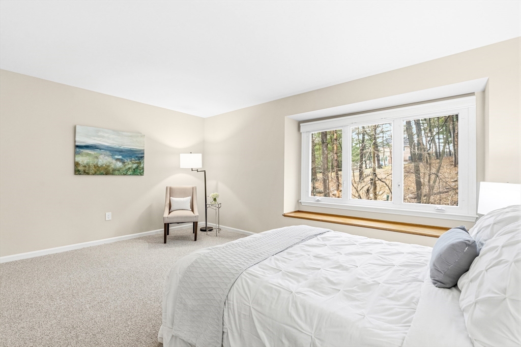 4 Drummer Boy Way, Unit 4 Lexington, MA 02420 - Photo 30 of 37 a bedroom with a bed and a large window