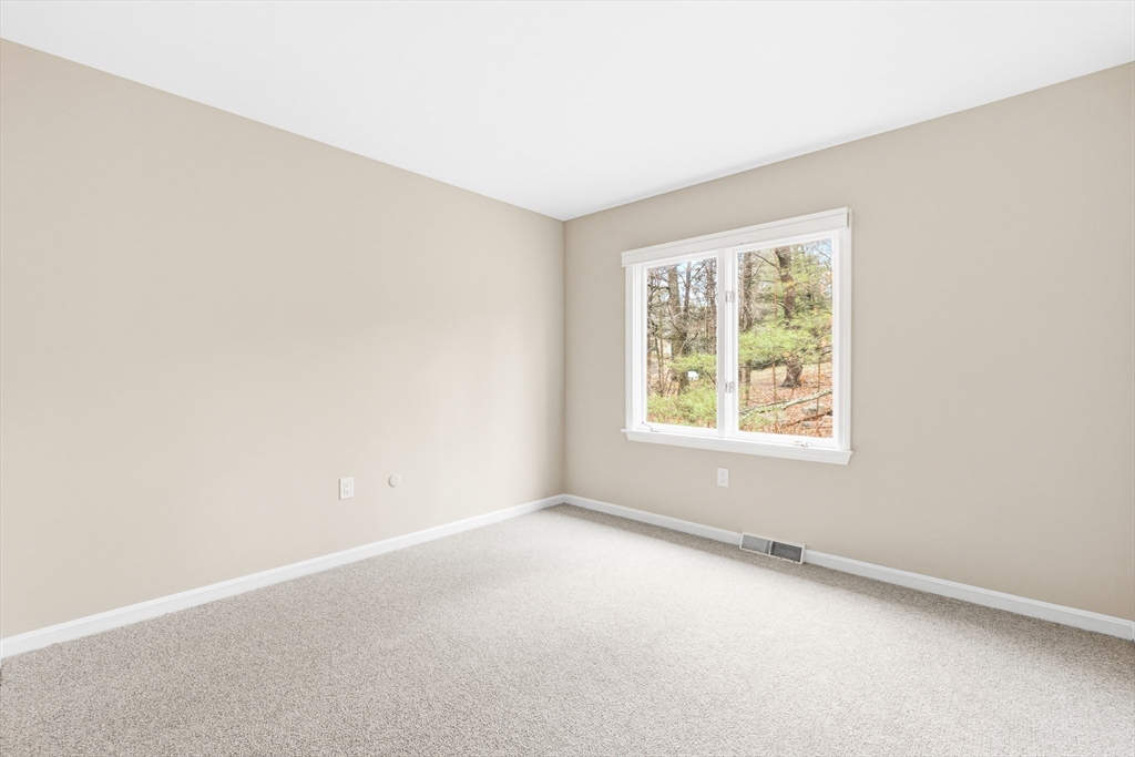 4 Drummer Boy Way, Unit 4 Lexington, MA 02420 - Photo 32 of 37 an empty room with windows