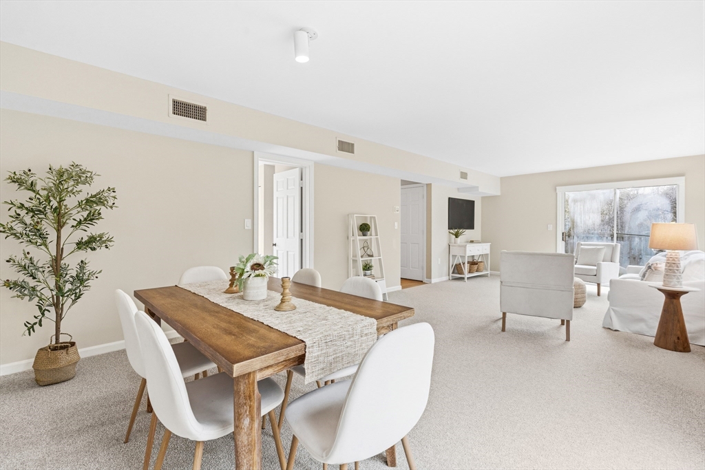 4 Drummer Boy Way, Unit 4 Lexington, MA 02420 - Photo 9 of 37 a dining room with furniture and window