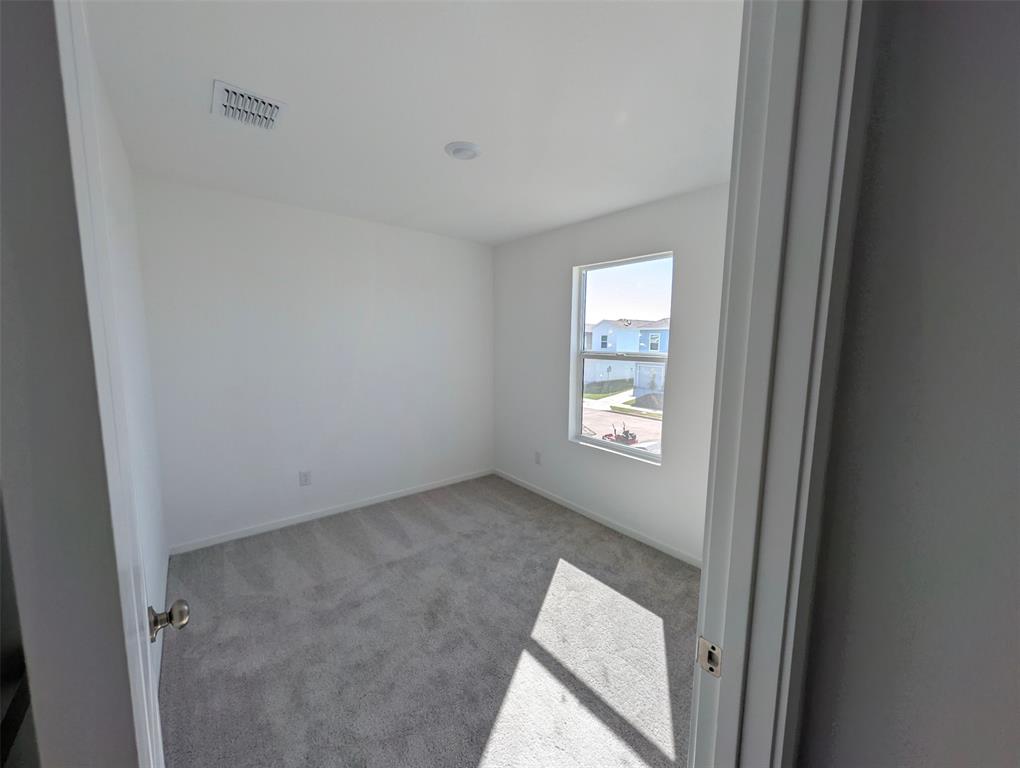 802 Sandhill Crane Lane Princeton, TX 75407 - Photo 15 of 18 an empty room with windows