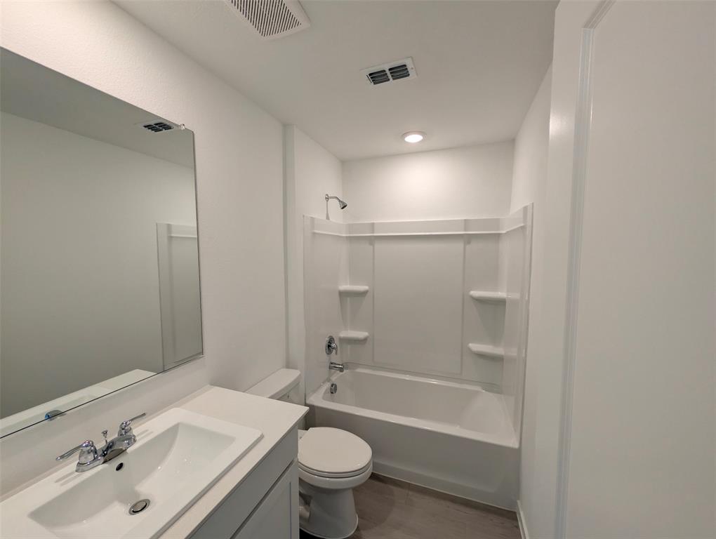 802 Sandhill Crane Lane Princeton, TX 75407 - Photo 16 of 18 a bathroom with a sink toilet and shower