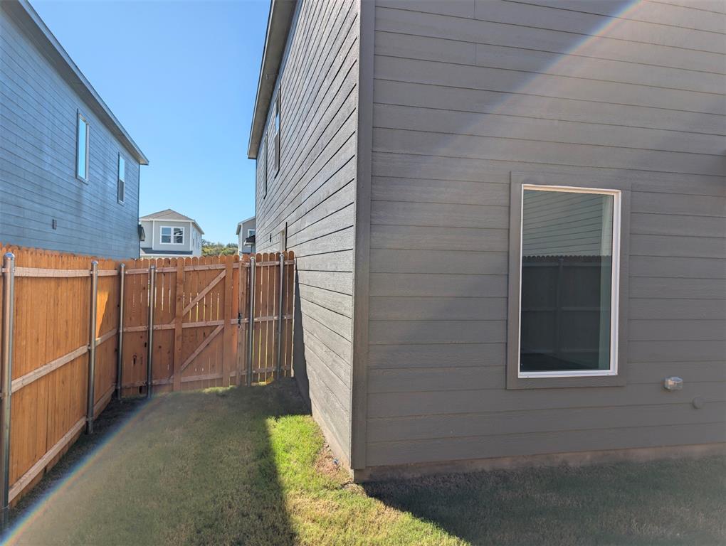 802 Sandhill Crane Lane Princeton, TX 75407 - Photo 7 of 18 a view of a house with a wooden fence