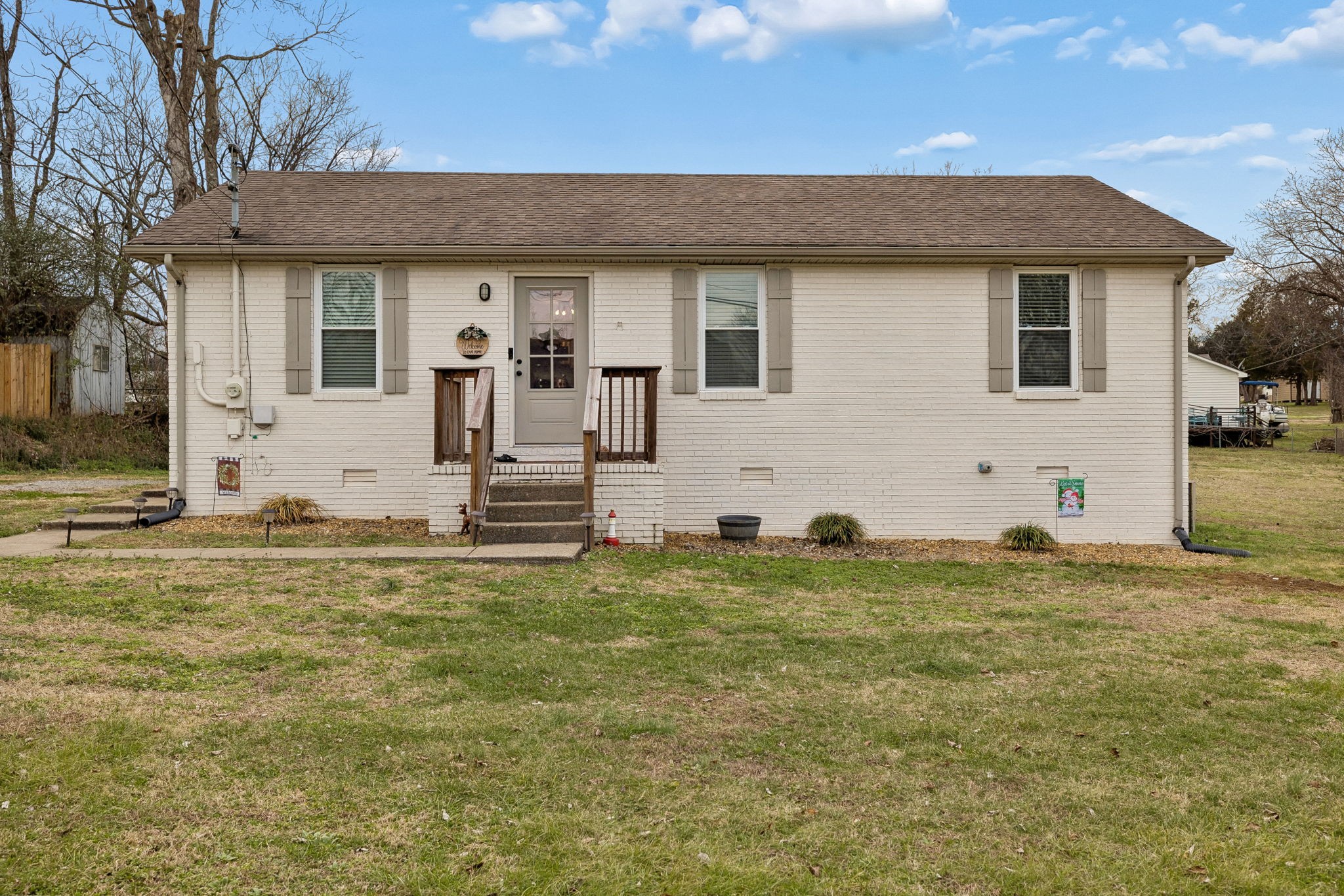 236 Commerce Avenue Watertown, TN 37184 - Photo 2 of 31 a house view with a garden space