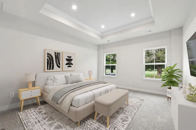 a bedroom with a large bed and a couch