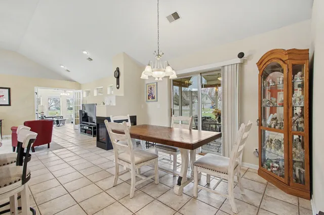 a bedroom with a bed and a flat tv screen on dresser