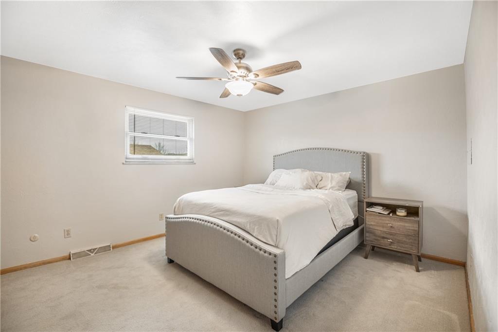 7 Josephine Street Slovan, PA 15078 - Photo 11 of 26 a bedroom with a bed and a ceiling fan
