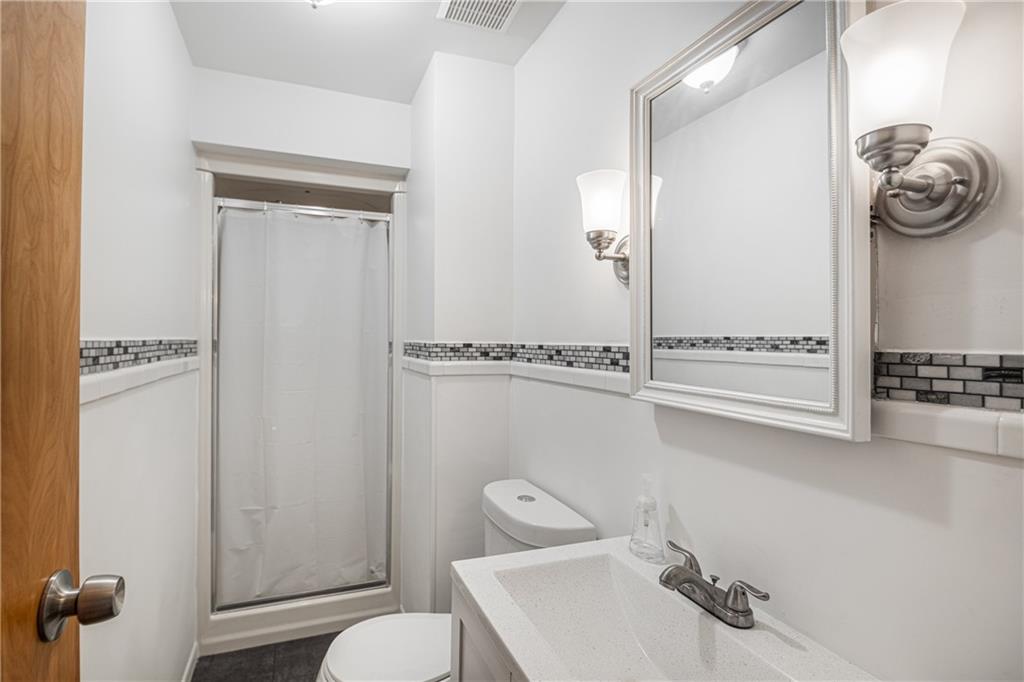 7 Josephine Street Slovan, PA 15078 - Photo 12 of 26 a bathroom with a sink a toilet and a mirror
