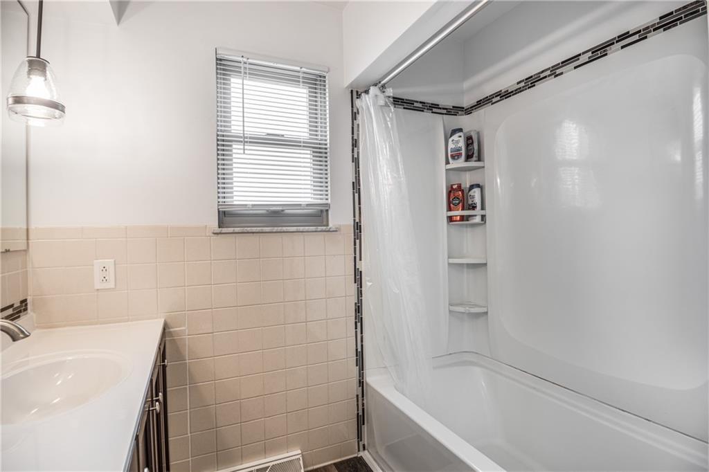7 Josephine Street Slovan, PA 15078 - Photo 17 of 26 a bathroom with a bathtub and a shower